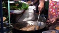 Cooking Thai food outdoors, fried boiling oil, pies