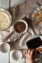 Cooking tiramisu on the white wooden table vertical