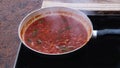 Cooking tomato sauce for pasta