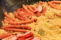 Cooking of traditional german dish - sauerkraut, sour cabbage in Riesling wine with sausages and meats, in big cauldron