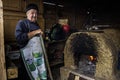 Cooking in a traditional oven, in a village near Constanta, Dobrogea land , Romania Royalty Free Stock Photo