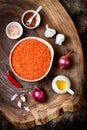 Cooking traditional red lentil Dal. Ingredients for Indian Dhal spicy curry. Royalty Free Stock Photo