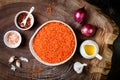 Cooking traditional red lentil Dal. Ingredients for Indian Dhal spicy curry. Royalty Free Stock Photo