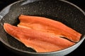 Cooking trout fish on frying pan
