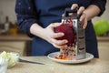 Young woman rubs beets. Cooking Ukrainian borscht step by step