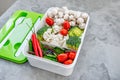 Cooking vegan food with raw vegetables. Broccoli and cauliflower, pepper and champignons for a vegetable dish in a plastic Royalty Free Stock Photo