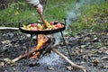 Cooking vegetables on the fire in the forest in autumn Royalty Free Stock Photo
