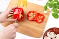 Cooking vegetables, healthy cooking. The process of slicing bell peppers. Mushrooms mushrooms, spinach leaves, chili