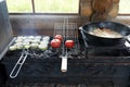 Cooking vegetables and pilaf on grill