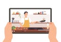 Cooking video. Hands holding tablet with culinary broadcast, show or online lesson. Chef preparing food in kitchen