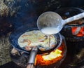 Cooking Vietnamese traditional seafood pancake