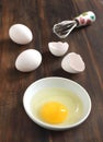 Cooking, whisk with eggs in a bowl and egg shells