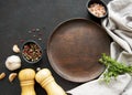 Cooking wooden utensils, empty plate and spices. Royalty Free Stock Photo