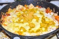 Cooking yellow curry in saucepan skillet many spices spicy chicken