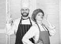 Cooking with your spouse can strengthen relationships. Teamwork in kitchen. Couple cooking dinner. Woman and bearded man
