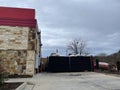 Cookout fast food restaurant building drive thru overflowing trash dumpsters