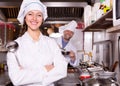 Cooks cooking at professional kitchen Royalty Free Stock Photo