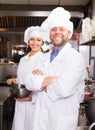 Cooks greeting customers at bistro