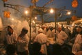 Cooks preparing food at outdoor food stalls