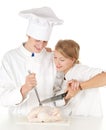 Cooks team preparing raw chicken Royalty Free Stock Photo