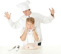 Cooks team preparing raw chicken Royalty Free Stock Photo