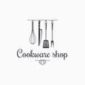 Cookware shop logo. Kitchen utensils on white