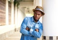 Cool african american man standing outdoors with arms crossed Royalty Free Stock Photo