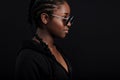 Cool african woman sitting with dark skin wearing round sunglasses Royalty Free Stock Photo