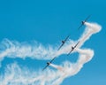Cool airplane show with planes flying and white smoke in the blue sky