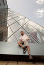 Cool bearded tattooed hipster posing in front of office building Royalty Free Stock Photo