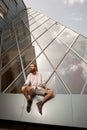 Cool bearded tattooed hipster posing in front of office building Royalty Free Stock Photo