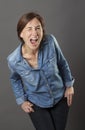 Cool beautiful middle aged woman making a dynamic funny face