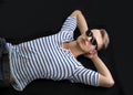 Cool blond young man laying on the floor with sunglasses on Royalty Free Stock Photo