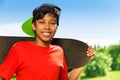 Cool boy in cap and with skateboard portrait Royalty Free Stock Photo