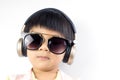 Cool boy is listening to music with golden headphone Royalty Free Stock Photo