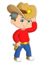 The cool boy is posing with a cowboy costume and having a good style Royalty Free Stock Photo