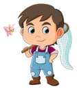 The cool boy is ready to catch a cute small butterfly while holding net Royalty Free Stock Photo