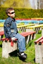 Cool boy sitting in a park Royalty Free Stock Photo