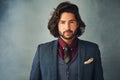 Cool, calm and collected. Studio portrait of a stylishly dressed handsome young man. Royalty Free Stock Photo