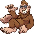 Cool cartoon bigfoot resting and wearing sunglasses.