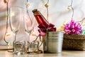 Cool Champagne and glass prepare for Celebration. Candle is lighting in a candlestick in Christmas and New year festival. Royalty Free Stock Photo