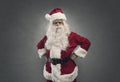 Cool confident Santa posing with arms akimbo