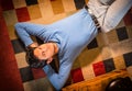 Cool dark-haired handsome young man laying on the floor Royalty Free Stock Photo