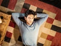Cool dark-haired handsome young man laying on the floor Royalty Free Stock Photo
