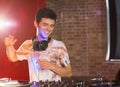 Cool dj spinning the decks Royalty Free Stock Photo