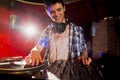 Cool dj spinning the decks Royalty Free Stock Photo