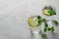 Cool drink with fresh lemon, mint leaves and ice. Lemonade, water with lemon Royalty Free Stock Photo