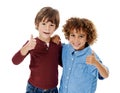 Cool dudes. Studio shot of two cute little boys giving you thumbs up against a white background. Royalty Free Stock Photo