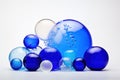 Cool Elegance: Cluster of Blue Glass Balls, A Display of Varied Sizes and Shades