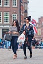 Cool fashionable girls on the Dam Square, Amsterdam, Netherlands